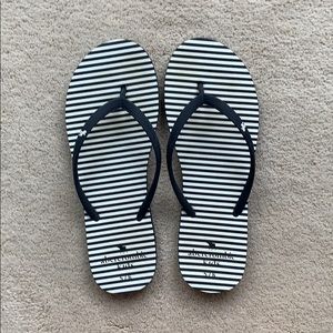 Blue and white striped flip flops